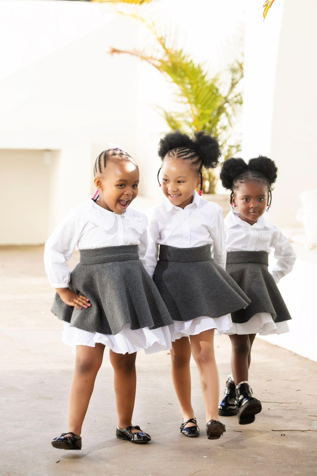 Happy kids with beautiful hairstyles at Tiny Tangles Salon